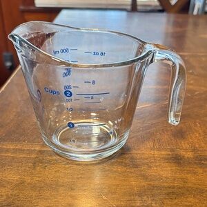 Glass Measuring Cup with Blue Markings In good used condition